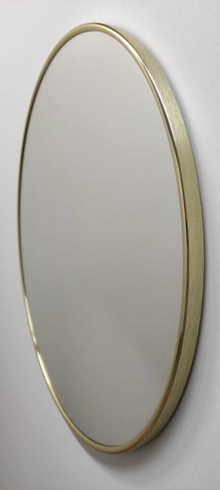 дзеркало кругле у металевій рамі