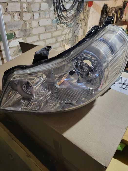 Фара Suziki SX4 2008 ліва оригінал
