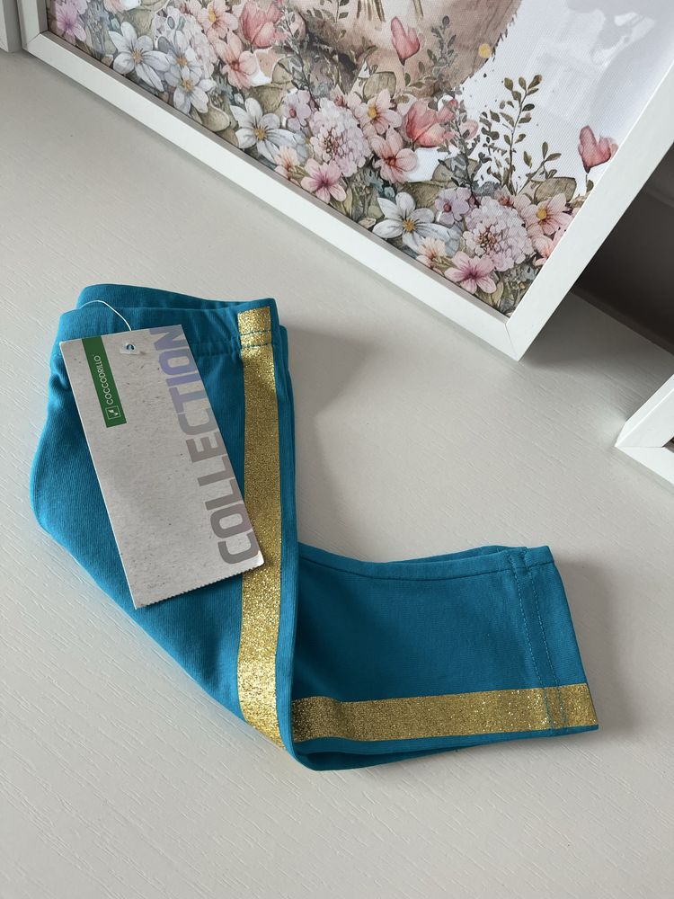 Nowe z metkami niebieskie legginsy ze złotym lampasem Coccodrillo 62