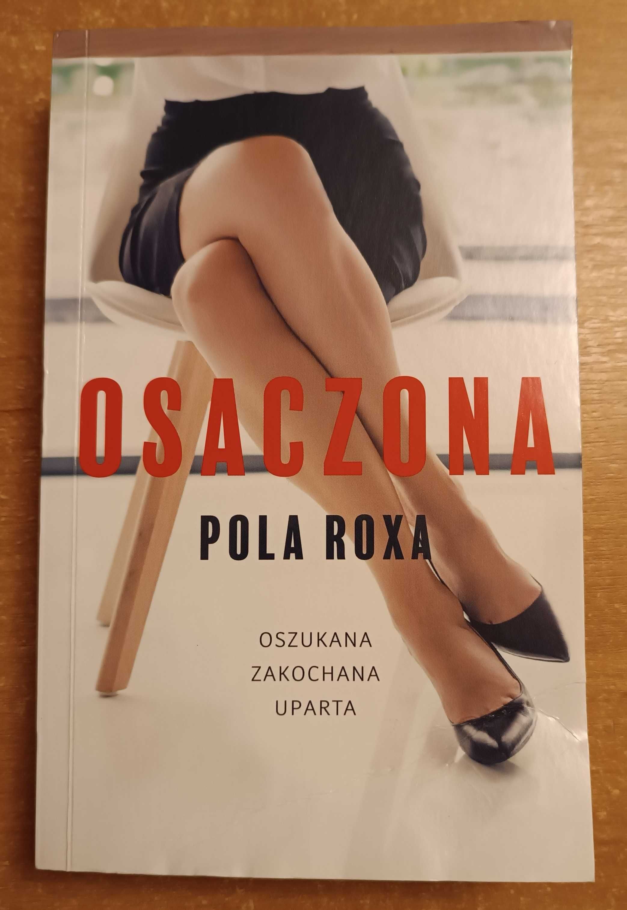 Książka "Osaczona" Pola Roxa (uszkodzona)