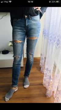 spodnie z dziurami przetarciami jeansy S 36