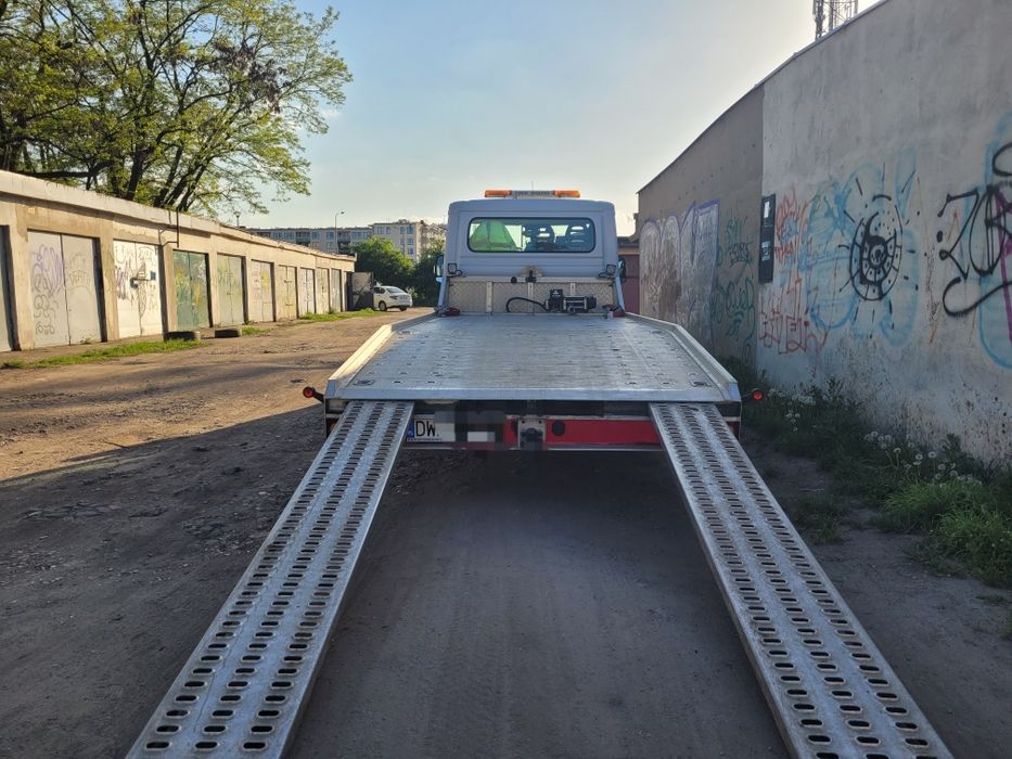 TANIO laweta pomoc drogowa holownik transport aut  24h