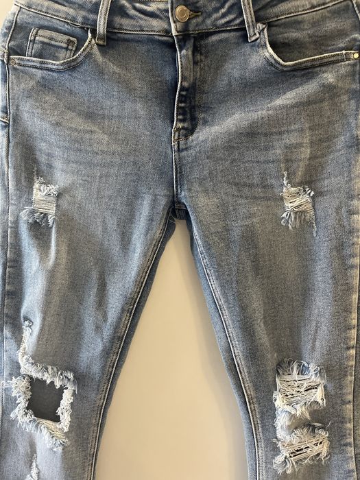 Jeansy z designerskimi dziurami - rozm. XL rozciagliwy material