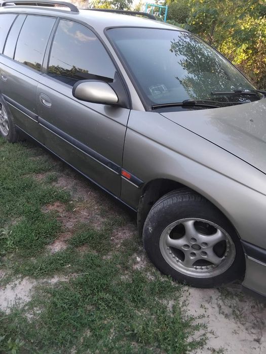 Opel Omega B,2,5 газ/бензин.