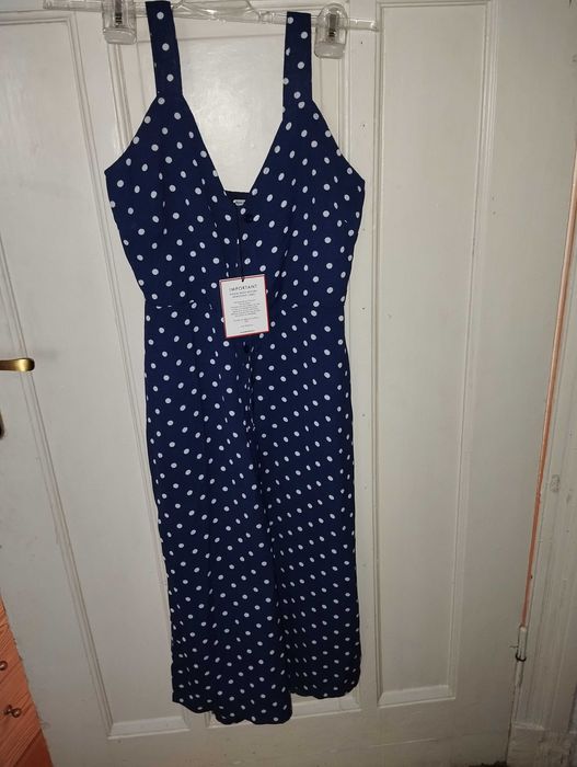 Kombinezon granatowy w kropki na guziki 34