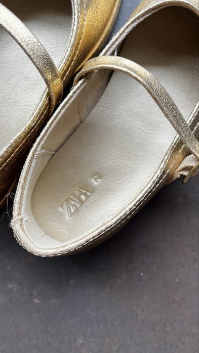 Golden shoes for a girl