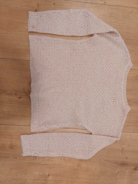 Elegancki różowy sweter