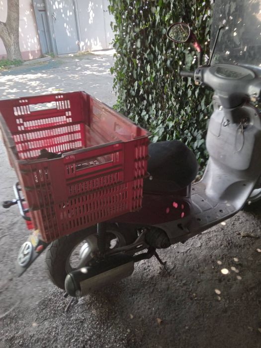 Продам скутер Ноnda  Topik, на ходу. С прицепом