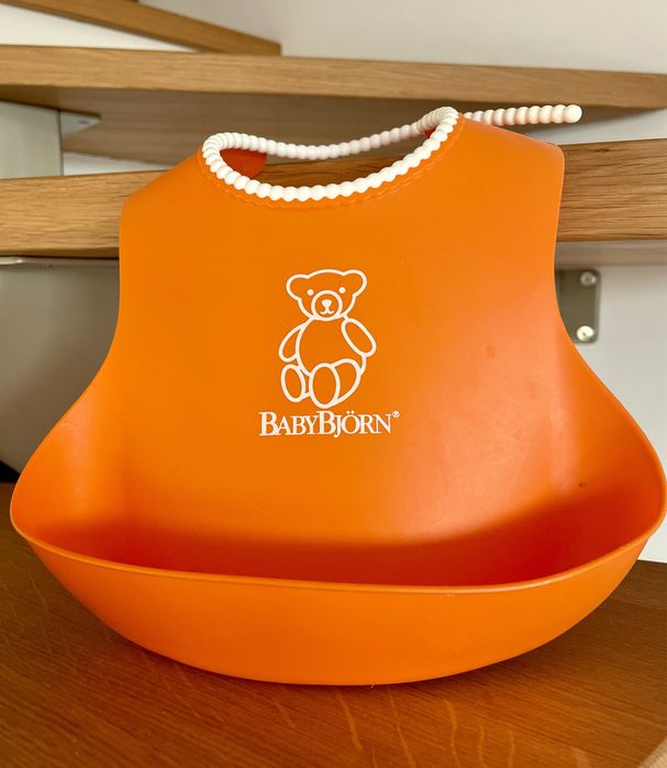 Śliniak silikonowy Baby Bjorn, pomarańczowy.