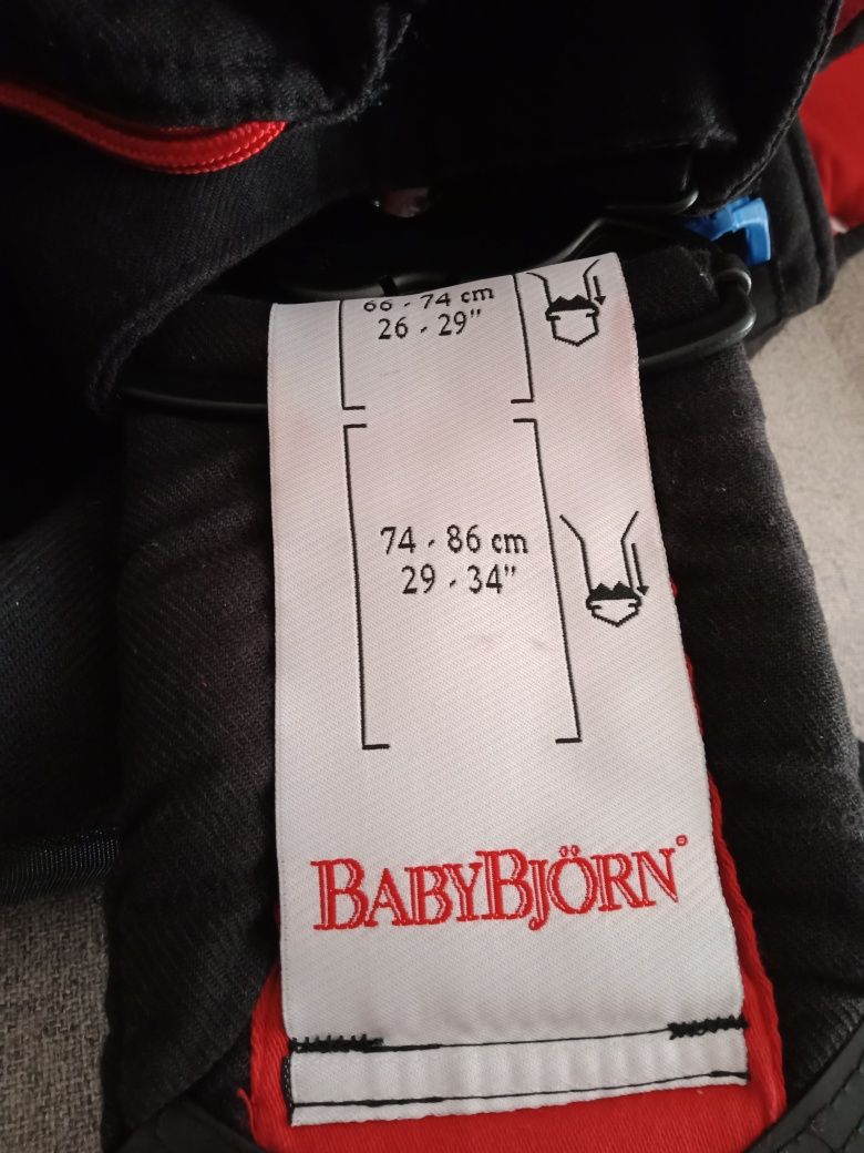 Nosidełko Baby Bjorn  czarne z czerwonymi dodatkami na wzrost od 53 do