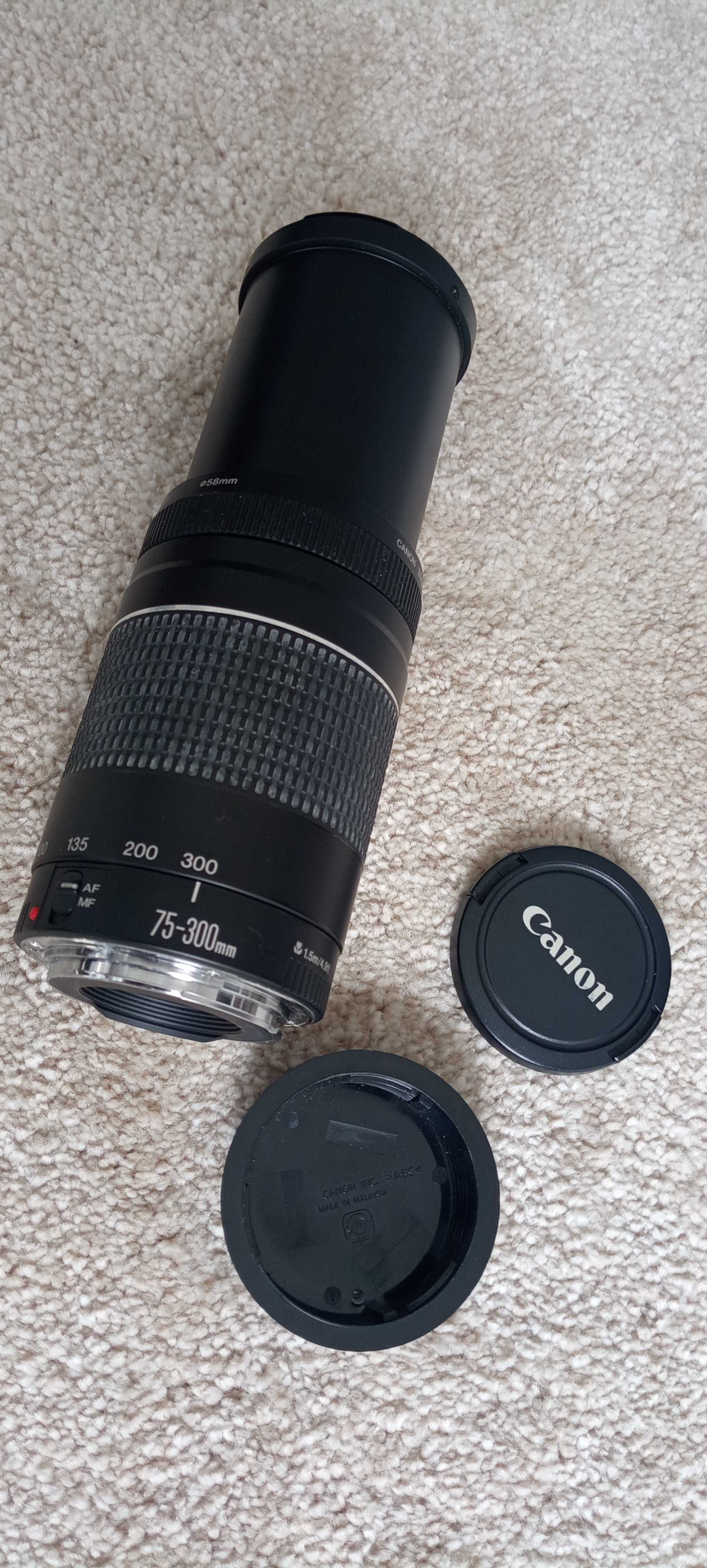 Canon EOS 1000D, com: objetivas 18-55 e 75-300; Carregador e Mala
