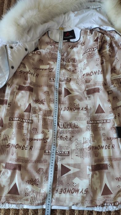 Білий пуховик жіночий