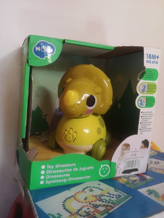 Каталка-динозаврик електронна Hola Toys музична 18х12 см з підсвічуван