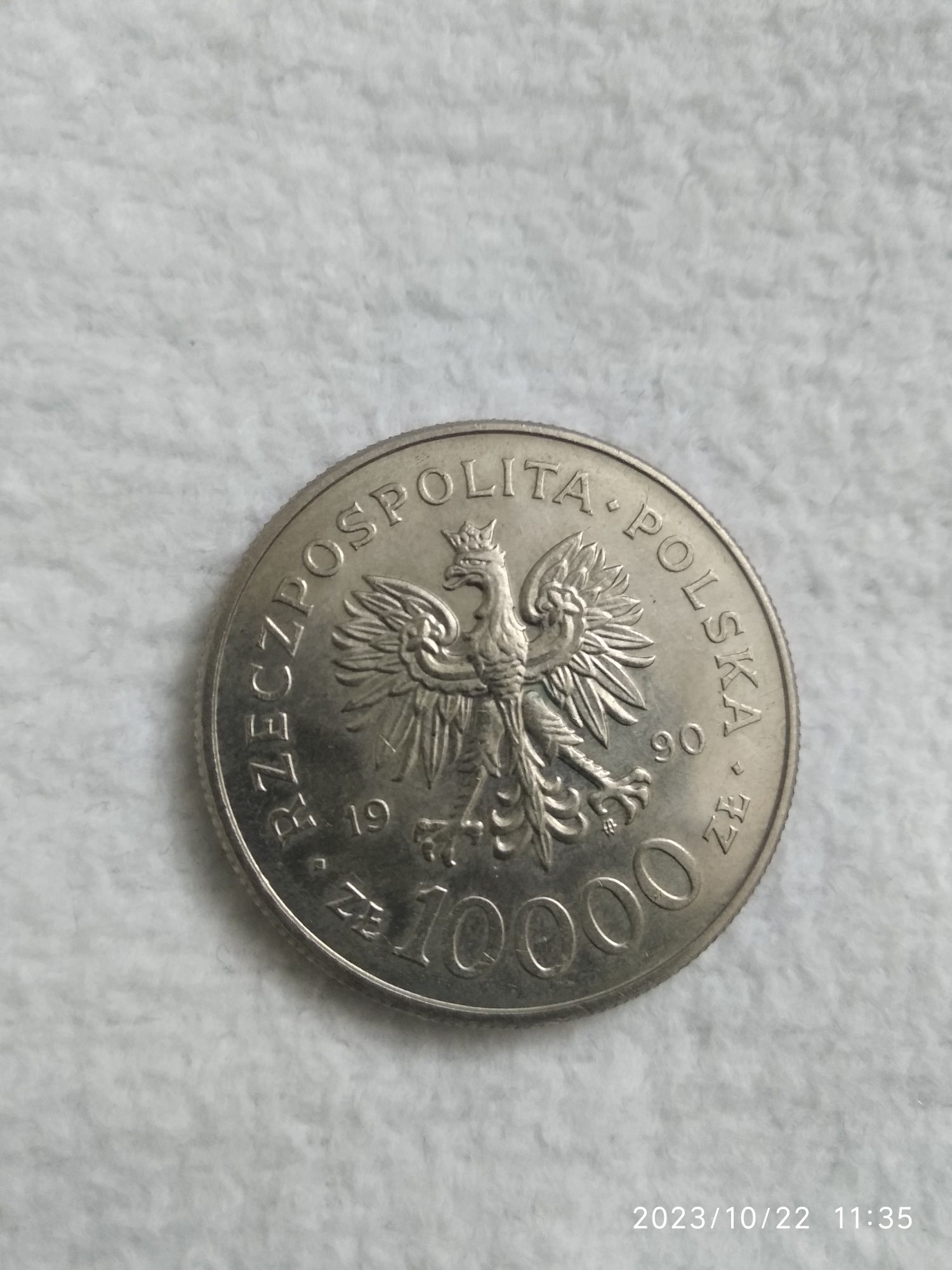 Moneta 10 000zł z roku 1990 z przodu Solidarność
Stan monet