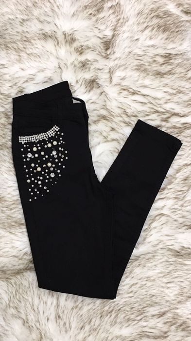 Czarne dżinsy jeansy skinny xs z biżuteryjnym zdobieniem calzedonia