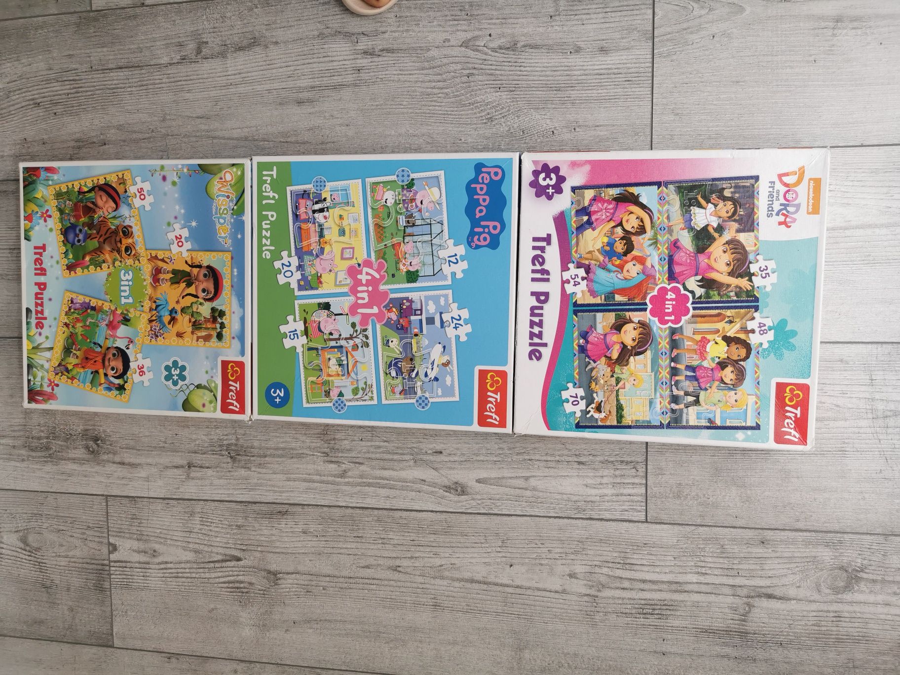 3 pudełka puzzli Dora Peppa Wissper