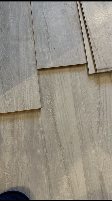 Продам б/у ламінат 50+ кв метрів сірого кольору  стан ідеал