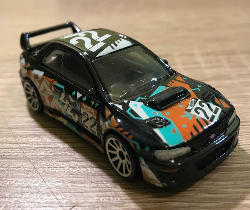 Hot Wheels  Subaru Impreza 22B Sti 1998 plus porsche carrera