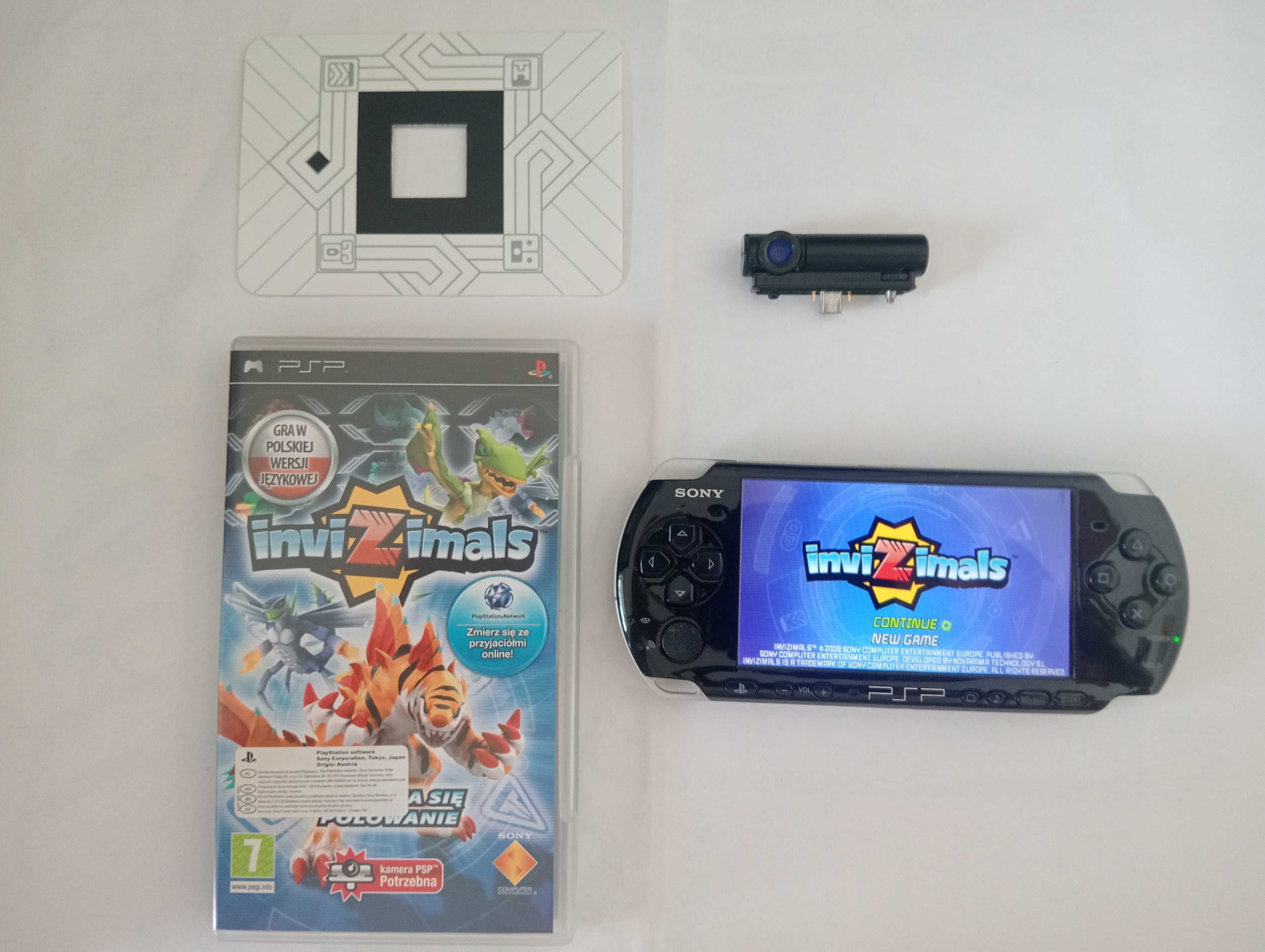 PSP 3004 + kamerka + 32GB pamięci z adapterem, ładowarka + 8 gier