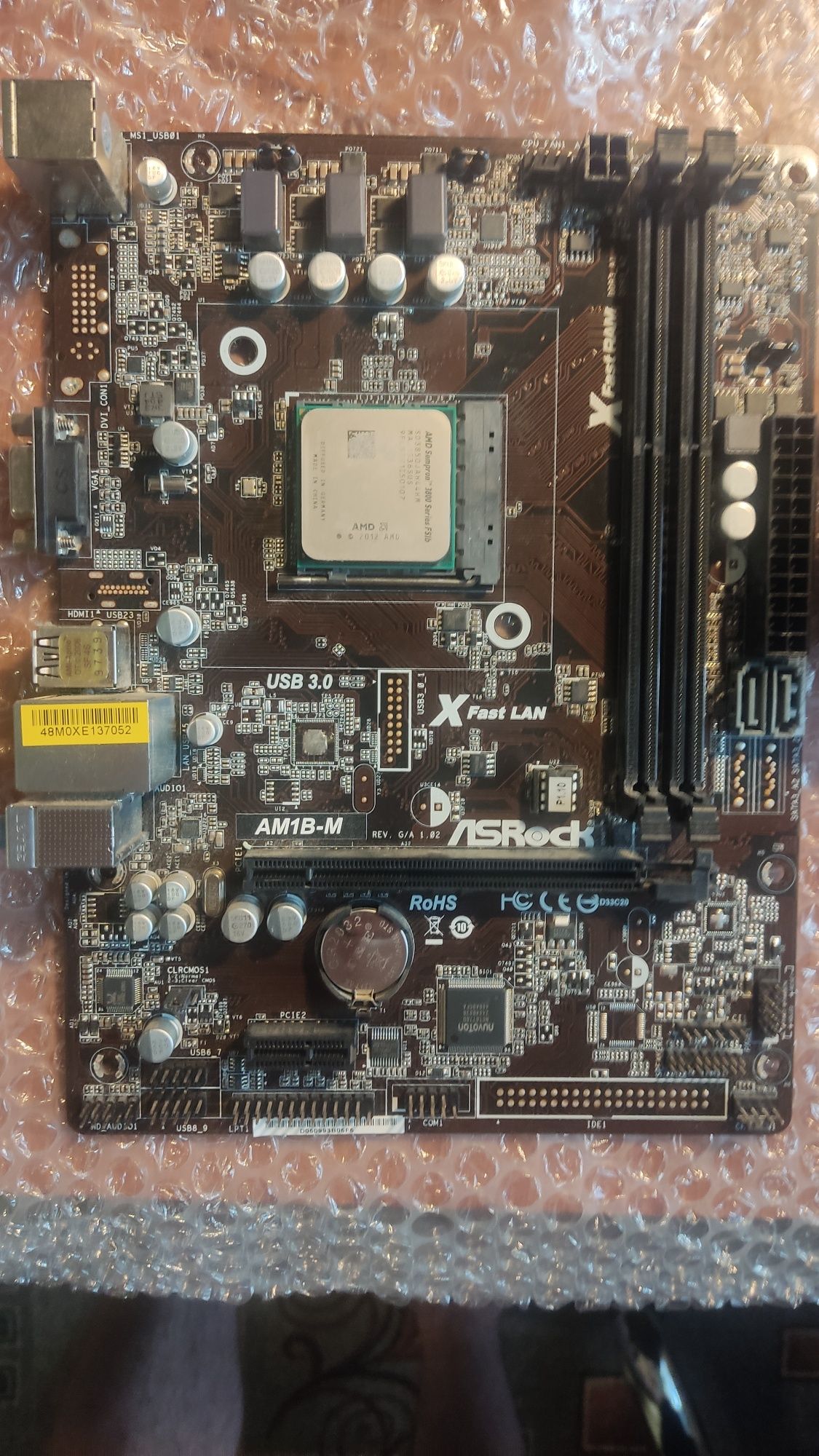Комплект Asrock AM1B-M та процессор