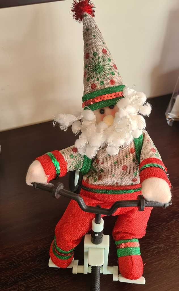 Mikołaj na rowerze - zabawka na baterie, sam jeździ
