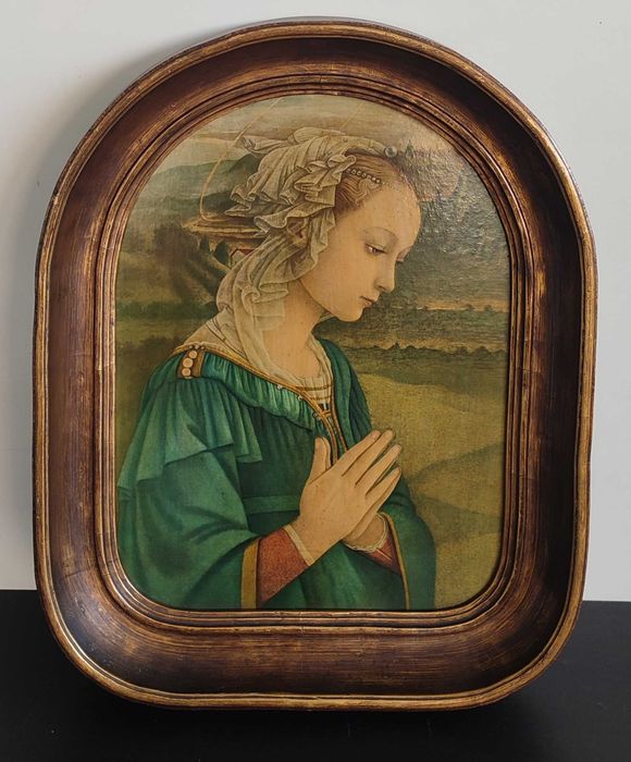 Quadro religioso com moldura dourada