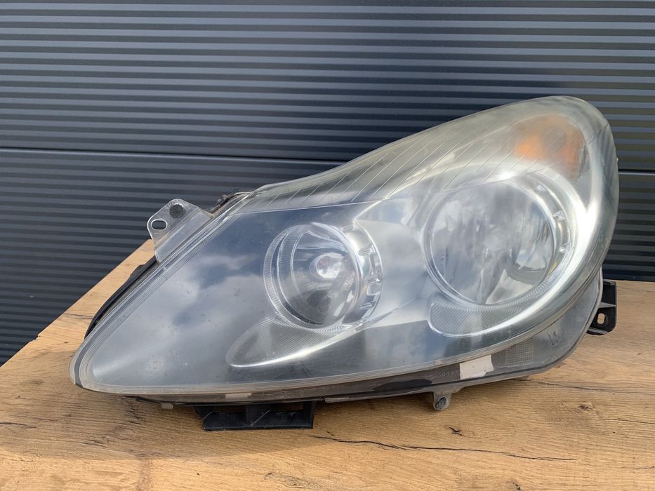 Opel Corsa D lampa lewa przednia lewy przód EUROPA