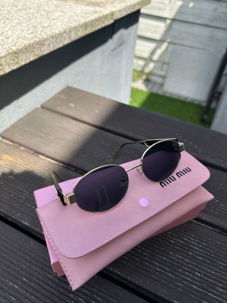 oculos miumiu novos ainda em caixa
