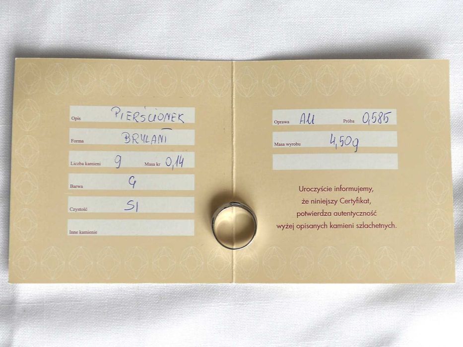 Pierścionek zaręczynowy - białe złoto z brylantami.