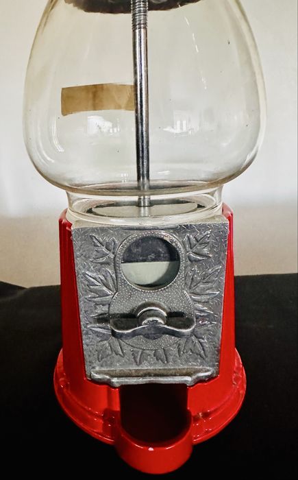Antiga máquina dispensadora de brindes