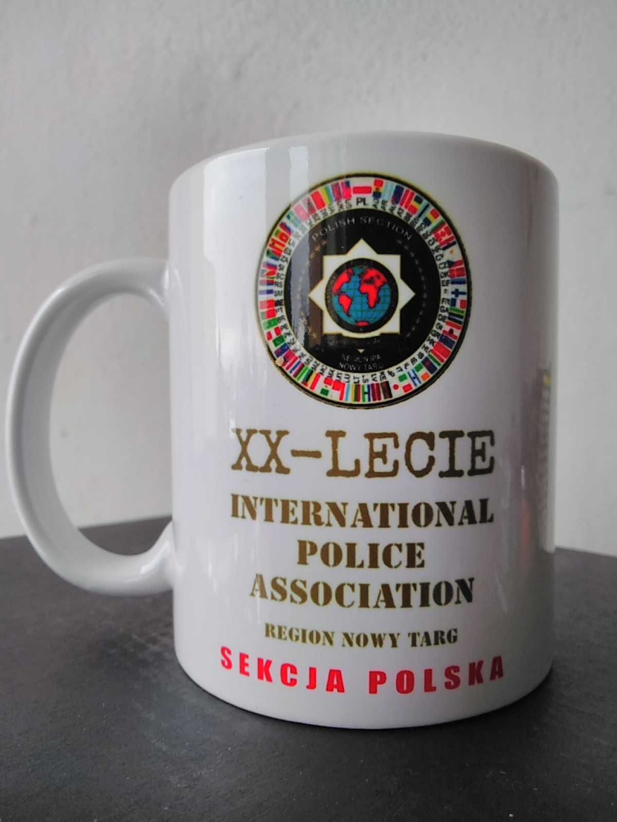 XX-Lecie International Police kubek