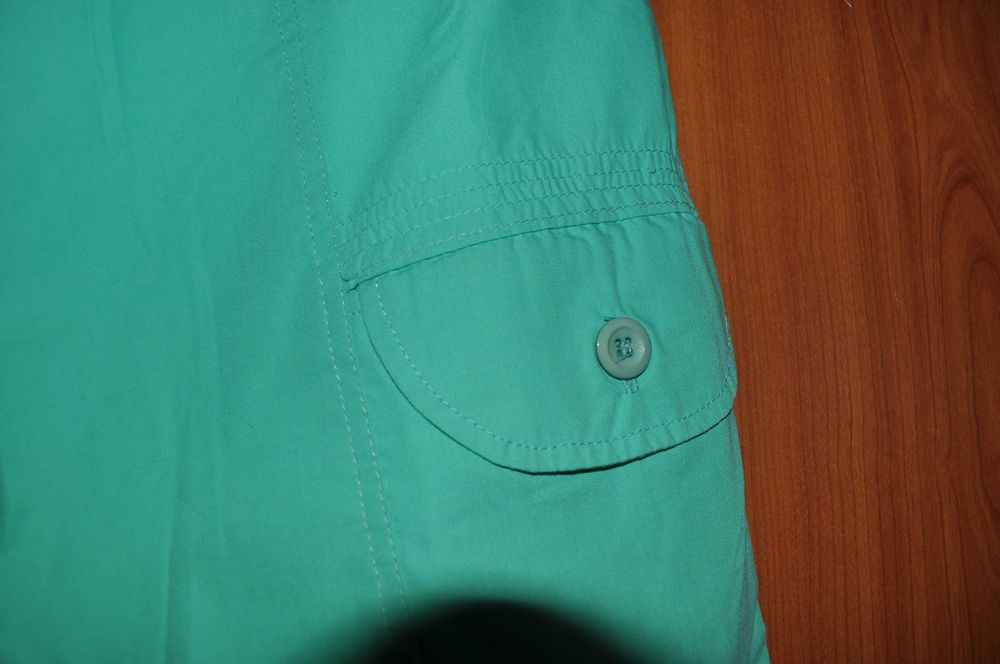 Spodnie dam. zielone r. 40, 3 zapinane kieszonki, guma w pasie, zamek.