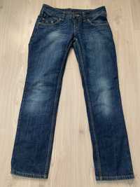 Spodnie jeans Tommy Hilfiger luźny fason. 30x32