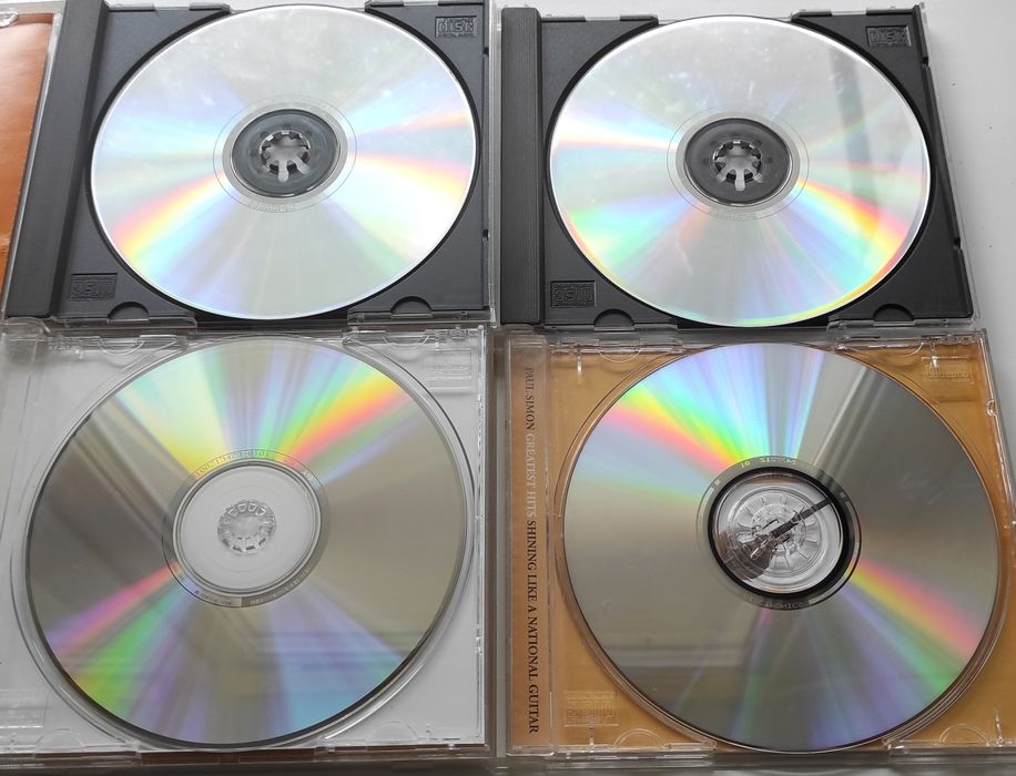 Buddy Holly, Proclaimers, Simon & Garfunkel, Paul Simon Фирменные CD