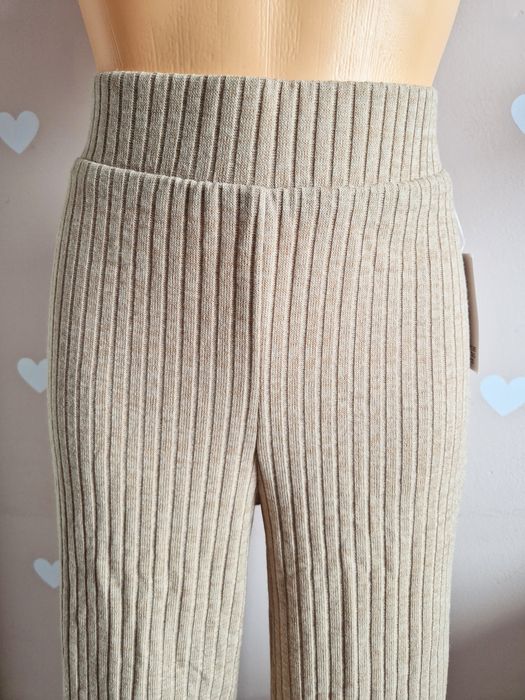 Spodnie materiałowe beżowe rozkloszowane szerokie dzwony prążkowane bu