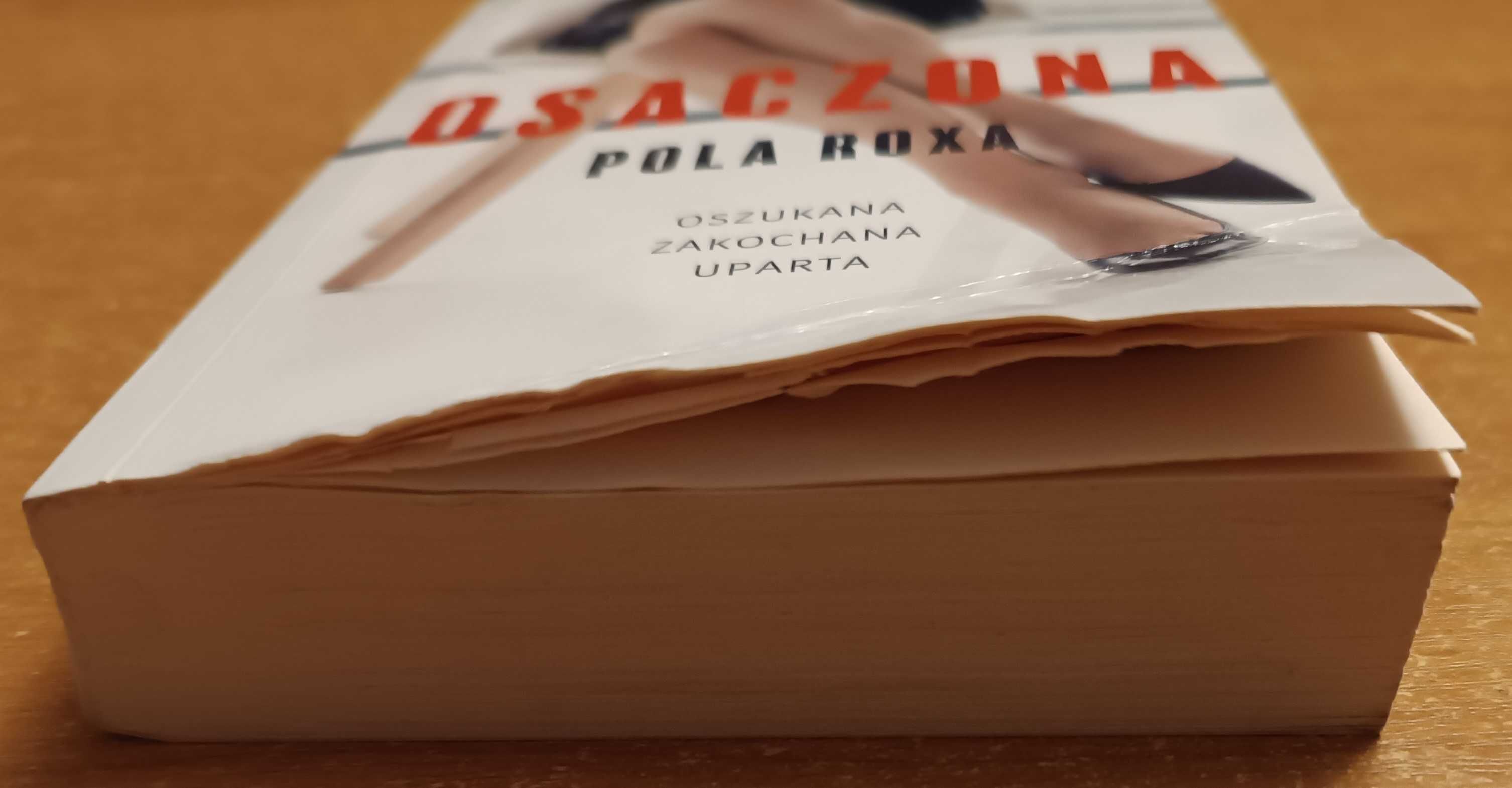 Książka "Osaczona" Pola Roxa (uszkodzona)