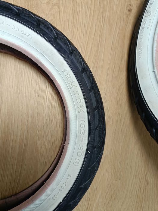 Opona  do wózka, rowerka DELI SA-206 12 1/2 x 2 1/4 biały bok