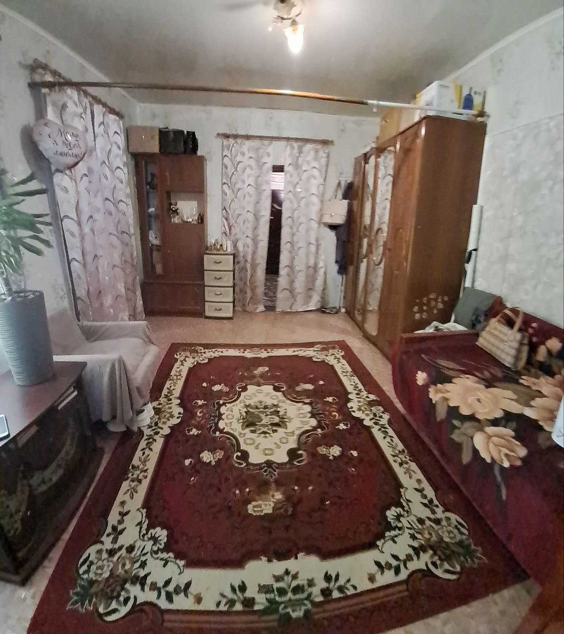 Продам 1\2 частину  будинку в центрі міста Чугуїв!