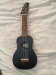 Ukelele de cor preta