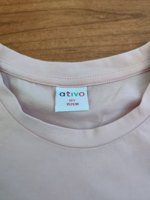 T-shirt rosa de menina da Ativo