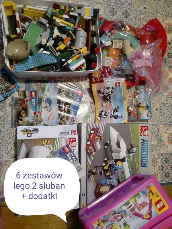 6 zestawów Lego oraz 2 Sluban, dodatkowo elementy domku i zjeżdżalnie