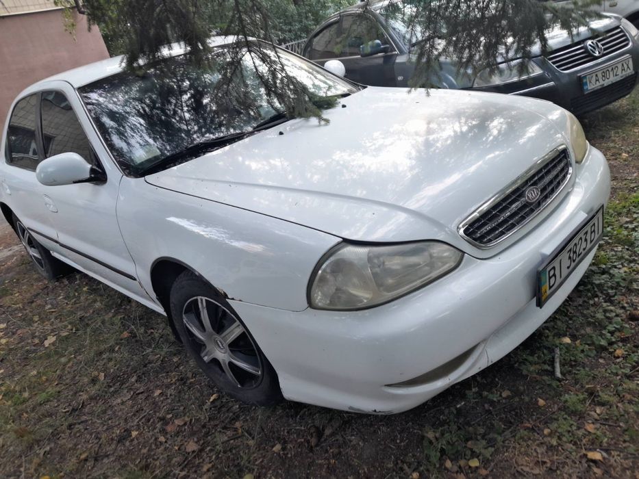 Кіа Кларус 2000 рік 2.0 газ/бензин ціна за двигун частинами