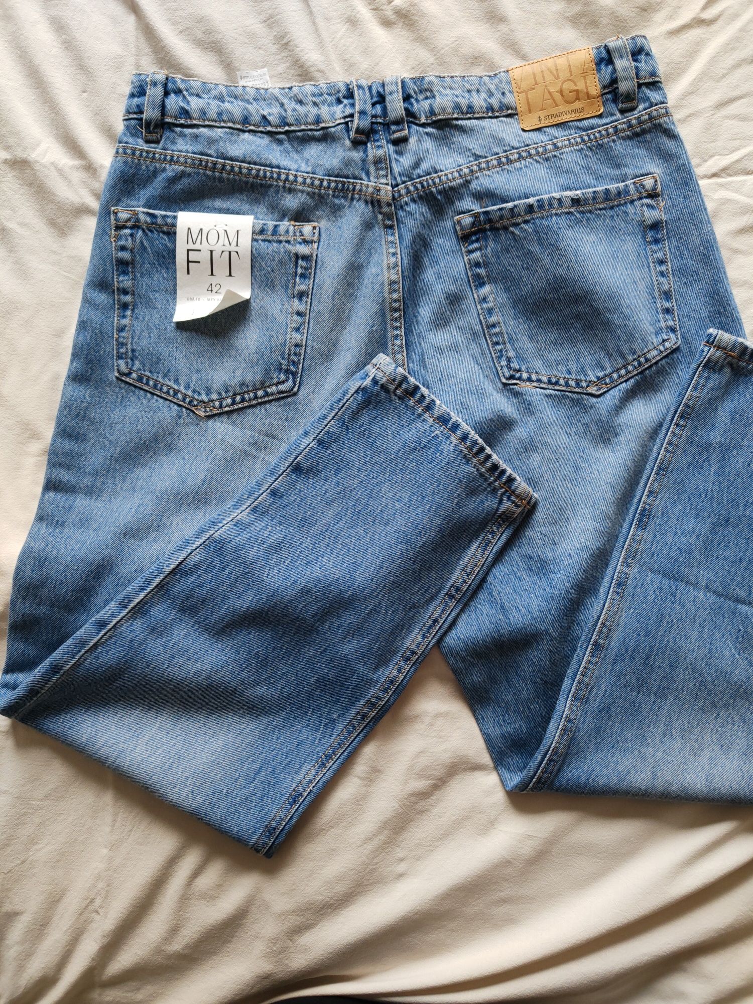 Jeansy zwężane Stradivarius 42 nowe