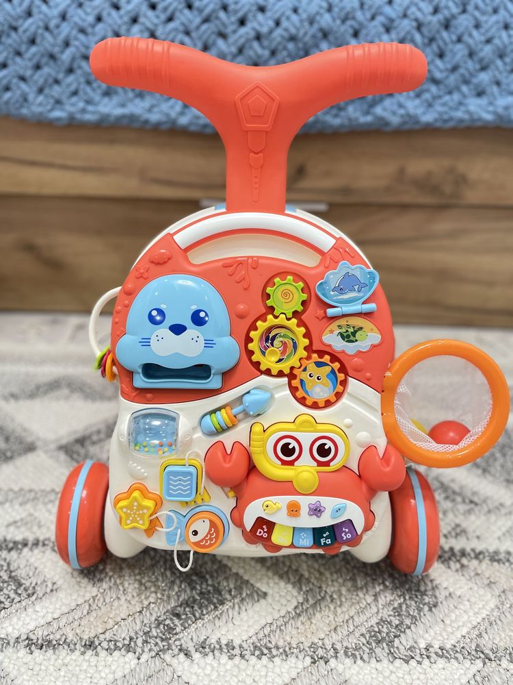 Ходунки-каталка ігровий розвивальний столик Caretero Spark Orange 2в1