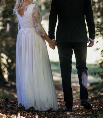 Suknia ślubna plus dwa welony