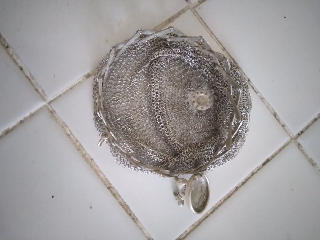 Porta moedas de prata.