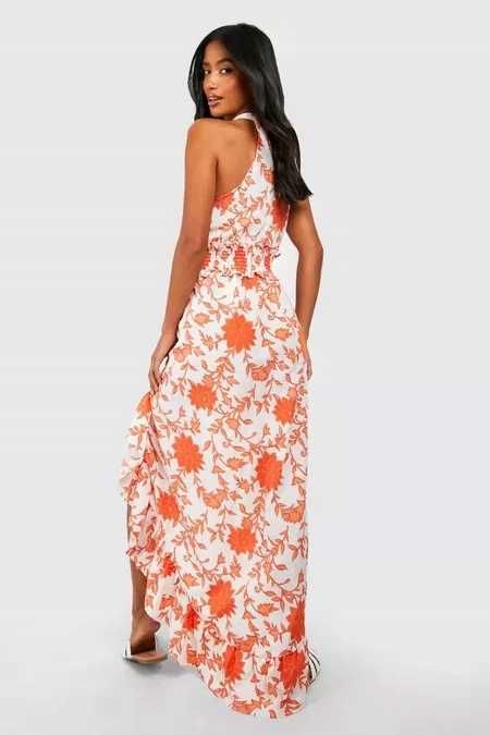 Zwiewna asymetryczna sukienka dekolt halter boho falbana