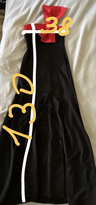 “Елегантна вечірня сукня з розрізом та бантом