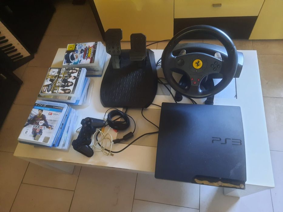 PS 3 com comando, volante, pedais e 22 jogos