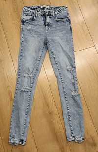 Jeansy skinny jeans z przetarciami